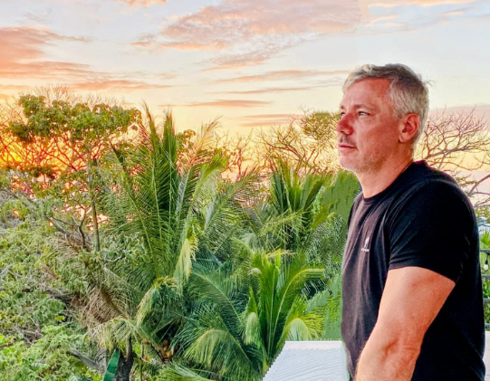 Shawn Wells watching a Nosara Costa Rica Sunset