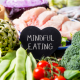 colorful food around a mindful eating sign