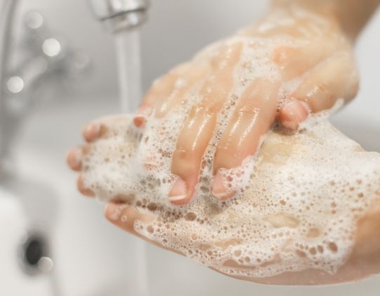 hands being washed to get bacteria off hands