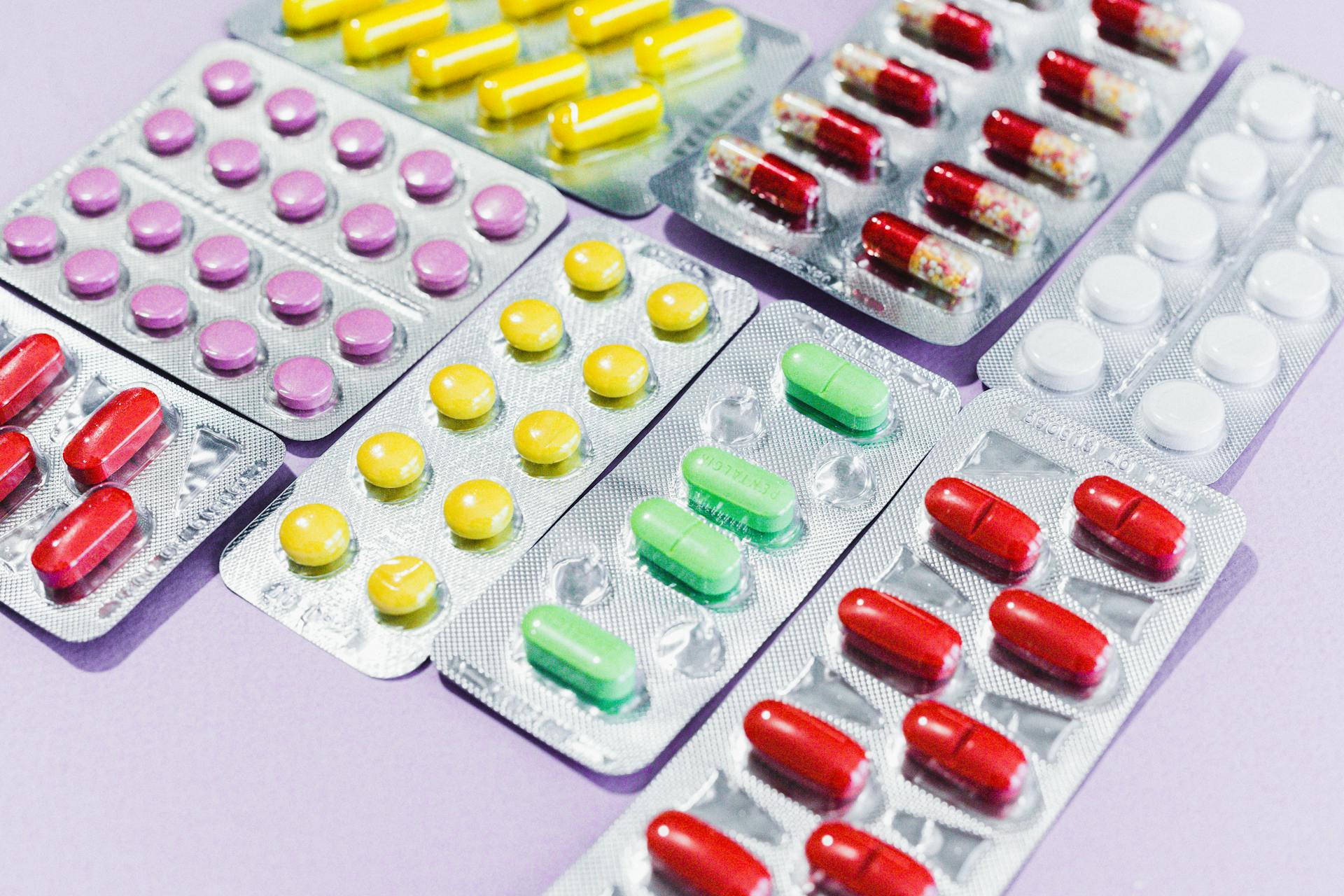 Blister packs of assorted pills representing medications that deplete nutrients and may affect vitamin and mineral absorption over time